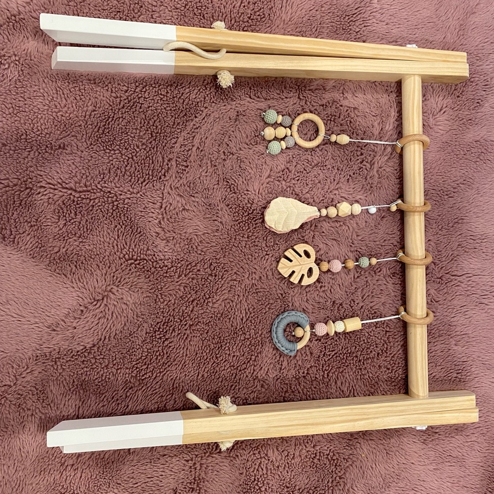 Wooden baby gym with 4 dangle ring toys